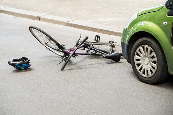 bike on ground in front of car