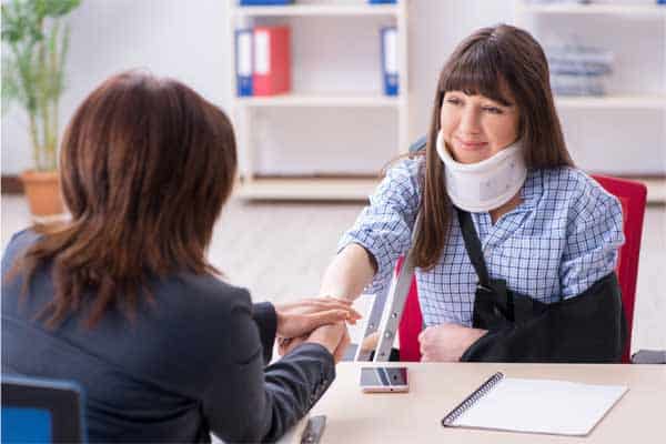 A woman meeting with an injury attorney