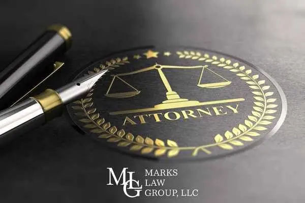 gold scales-of-justice seal embossed "attorney" beside a fountain pen, with a logo watermark