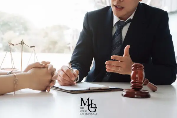 an attorney discussing an injury claim with a prospective client