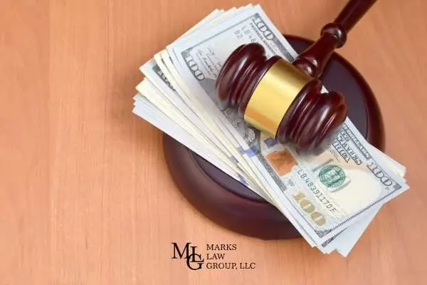 a gavel and money on a desk