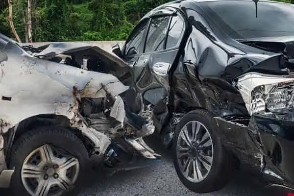 front of a light truck smashed into the side of a black car