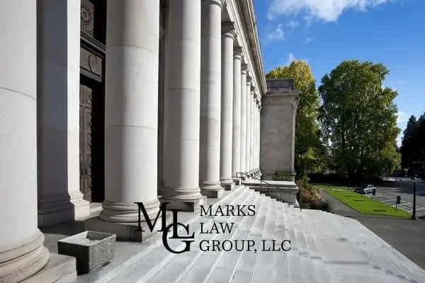 Row of tall stone columns along the steps of a classical courthouse