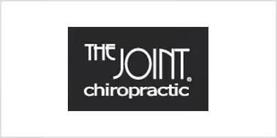 The Joint Chiropractic logo in white lettering on a black rectangle