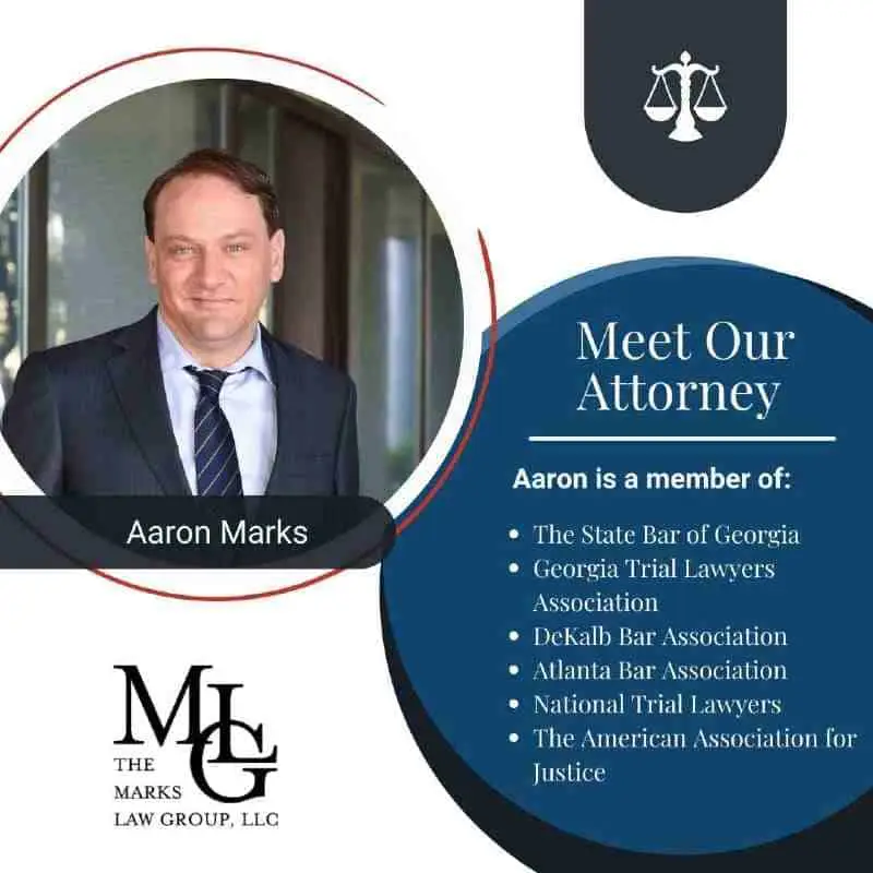 "Meet Our Attorney" card with a portrait of Aaron Marks and his bar association memberships
