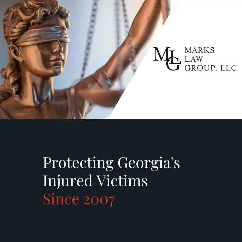 Blindfolded Lady Justice statue above the words Protecting Georgia's Injured Victims Since 2007