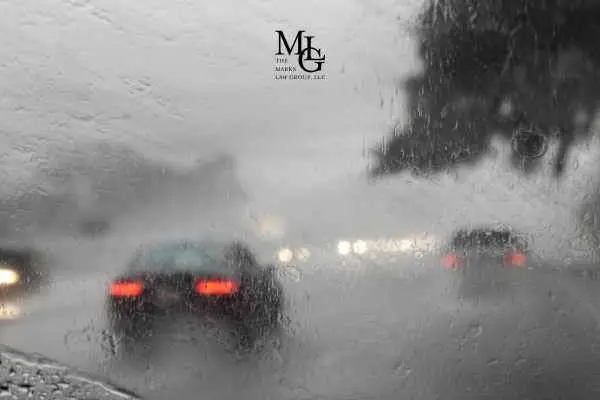 cars driving in heavy rain